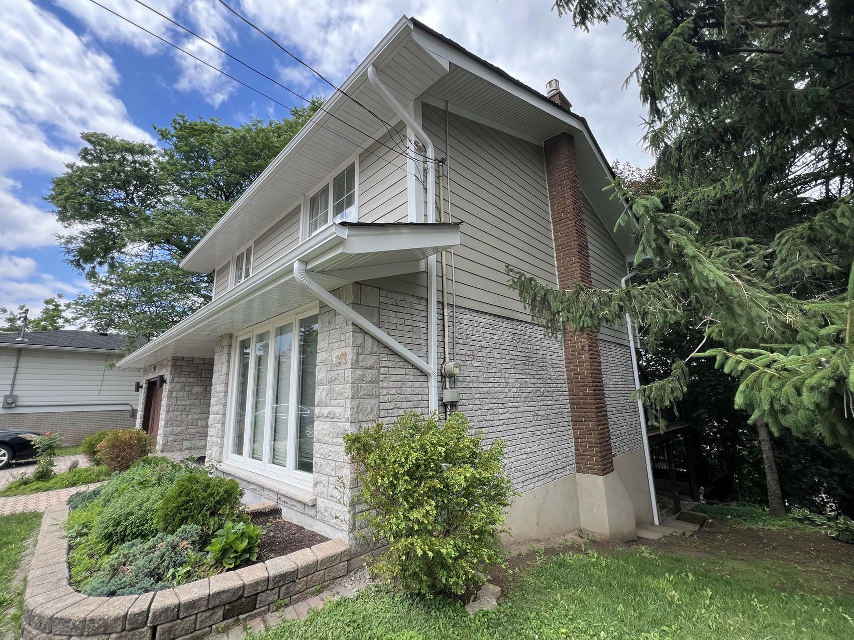 Side elevation of completed James Hardie lap siding renovation in Hamilton
