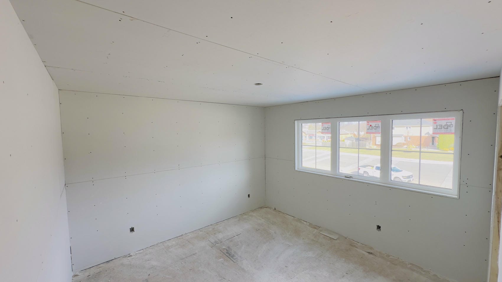 Taped and mudded drywall walls in Niagara bedroom renovation