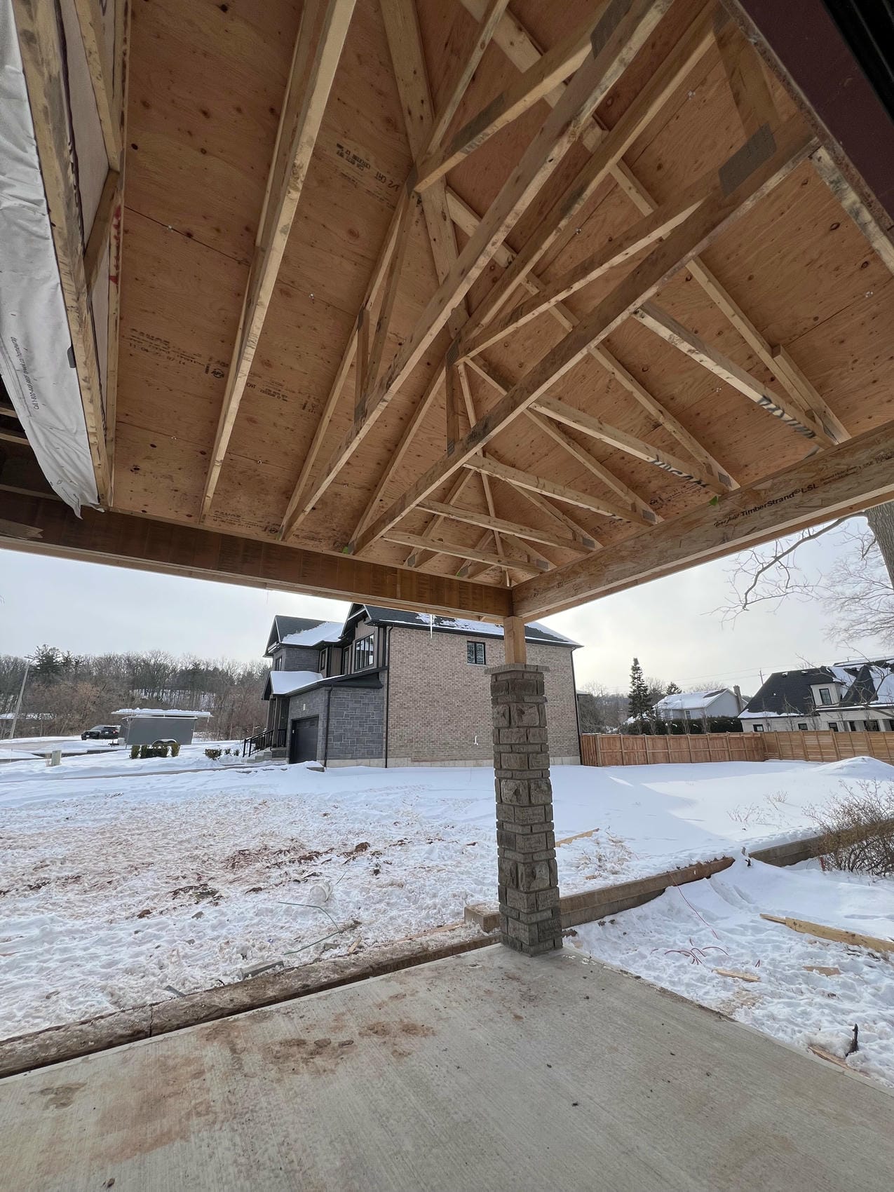Covered porch framing and roof trusses on Niagara renovation