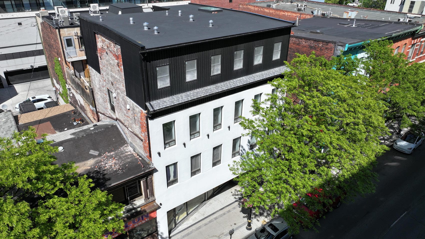 Completed four-storey commercial aluminum siding project in Hamilton Ontario
