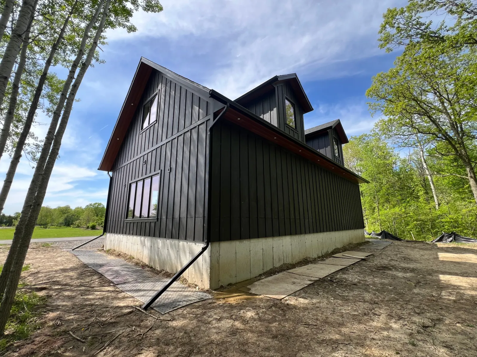 Modern home with dark aluminum porch soffit and fascia