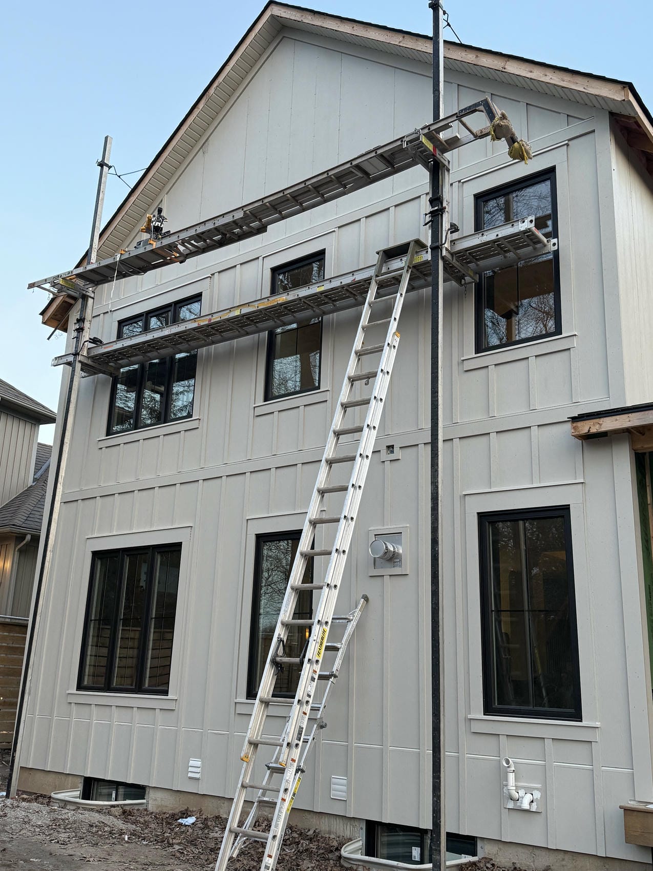 James Hardie board and batten siding on premium new build exterior in Puslinch