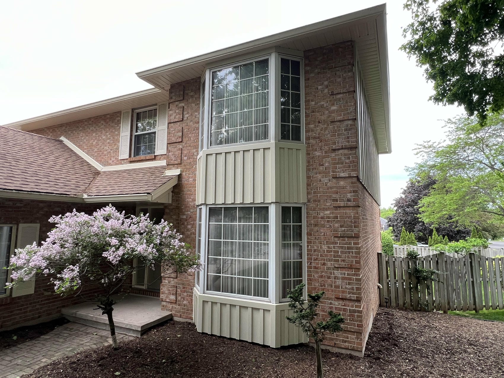 Completed board and batten siding renovation by Renovation Xperts Group in Pelham