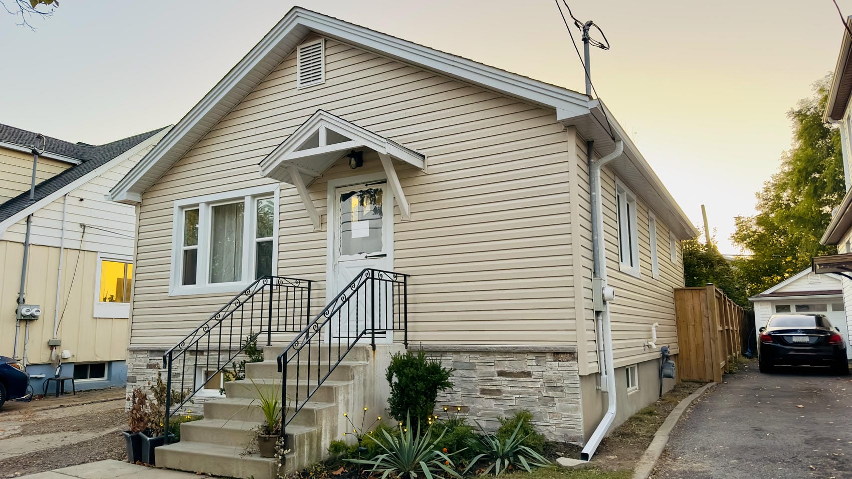 Completed exterior renovation with vinyl siding, Versetta Stone, soffit and fascia in St. Catharines