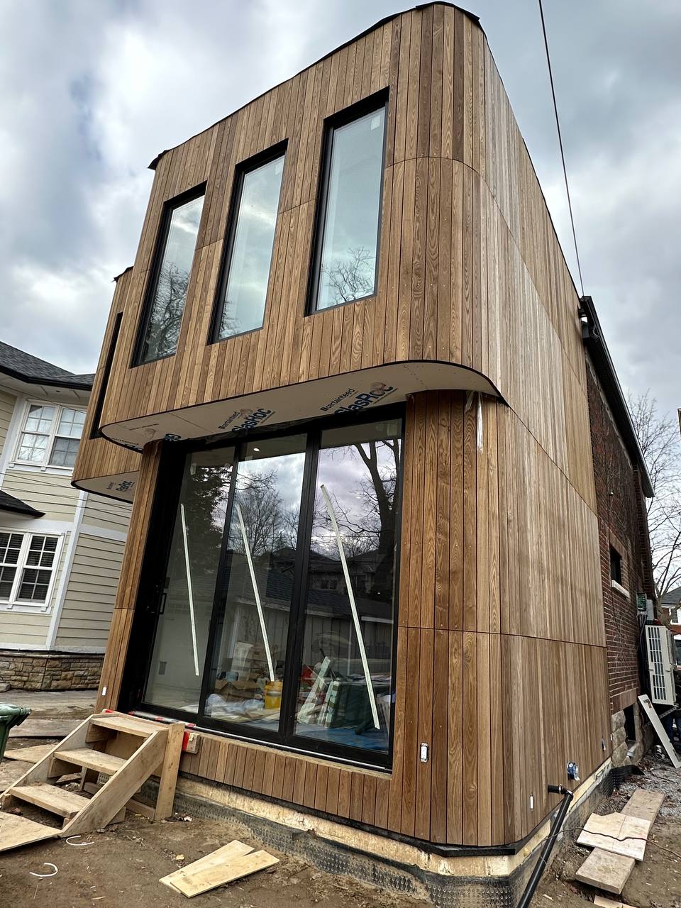 Premium wood siding installation on modern home in Niagara Region