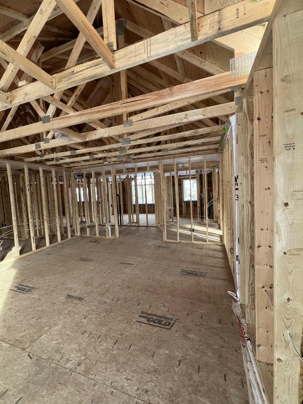 Interior framing with vaulted ceiling trusses in Niagara home renovation