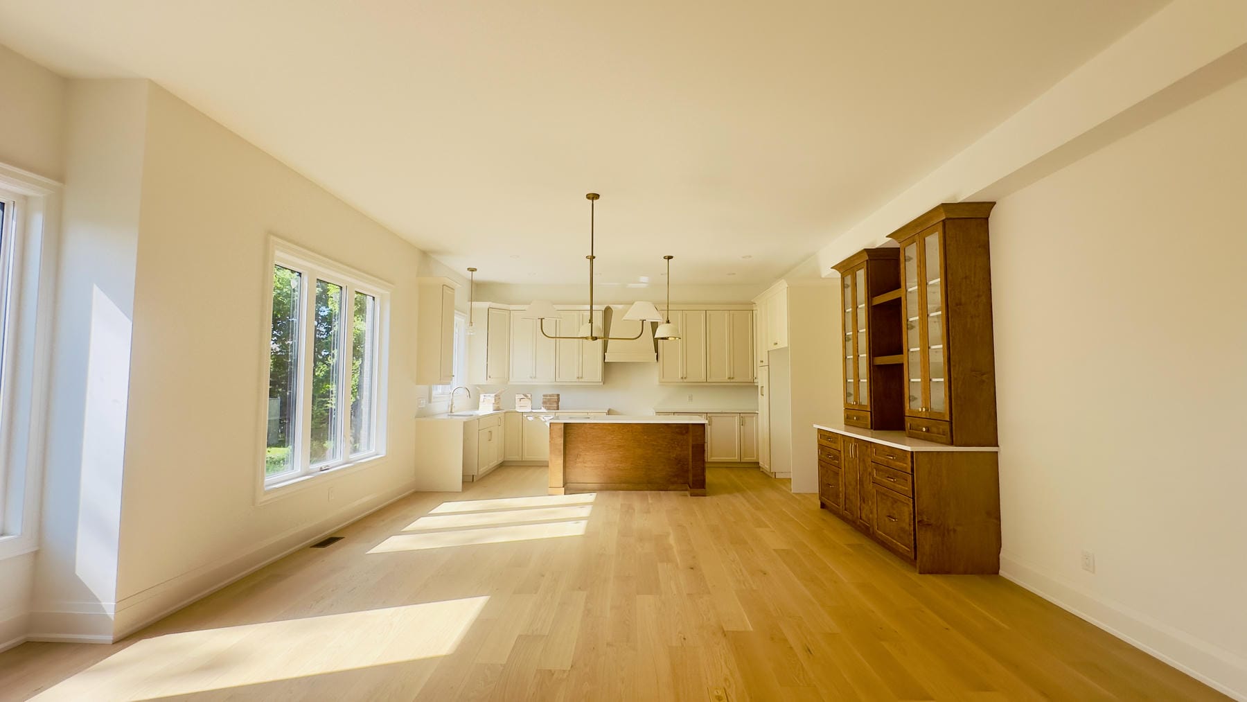 Interior renovation with hardwood floors, custom cabinetry, and bright open kitchen