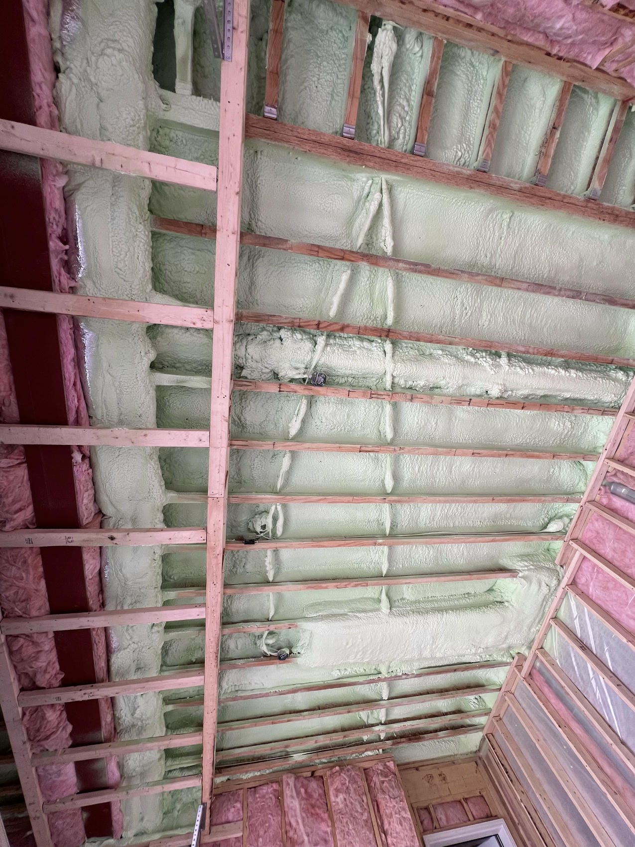 Closed-cell spray foam insulation applied to ceiling in Niagara