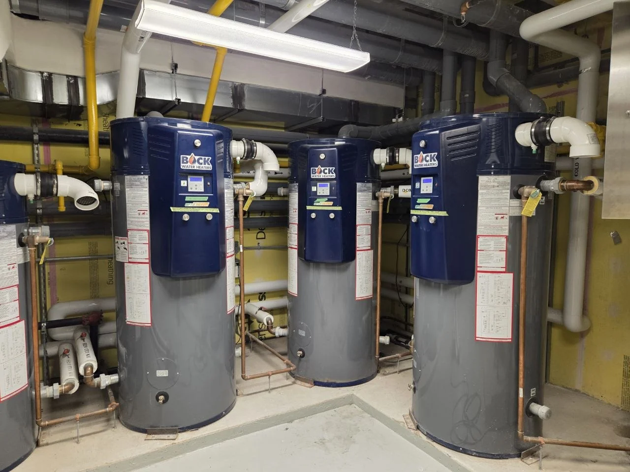 Blue Bock storage water heaters in a commercial mechanical room