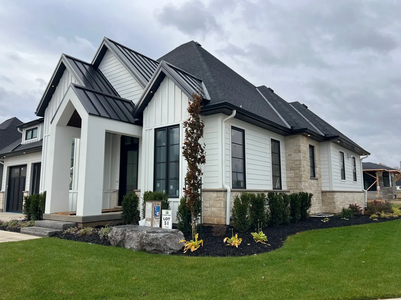 Finished new build home exterior with siding and aluminum details