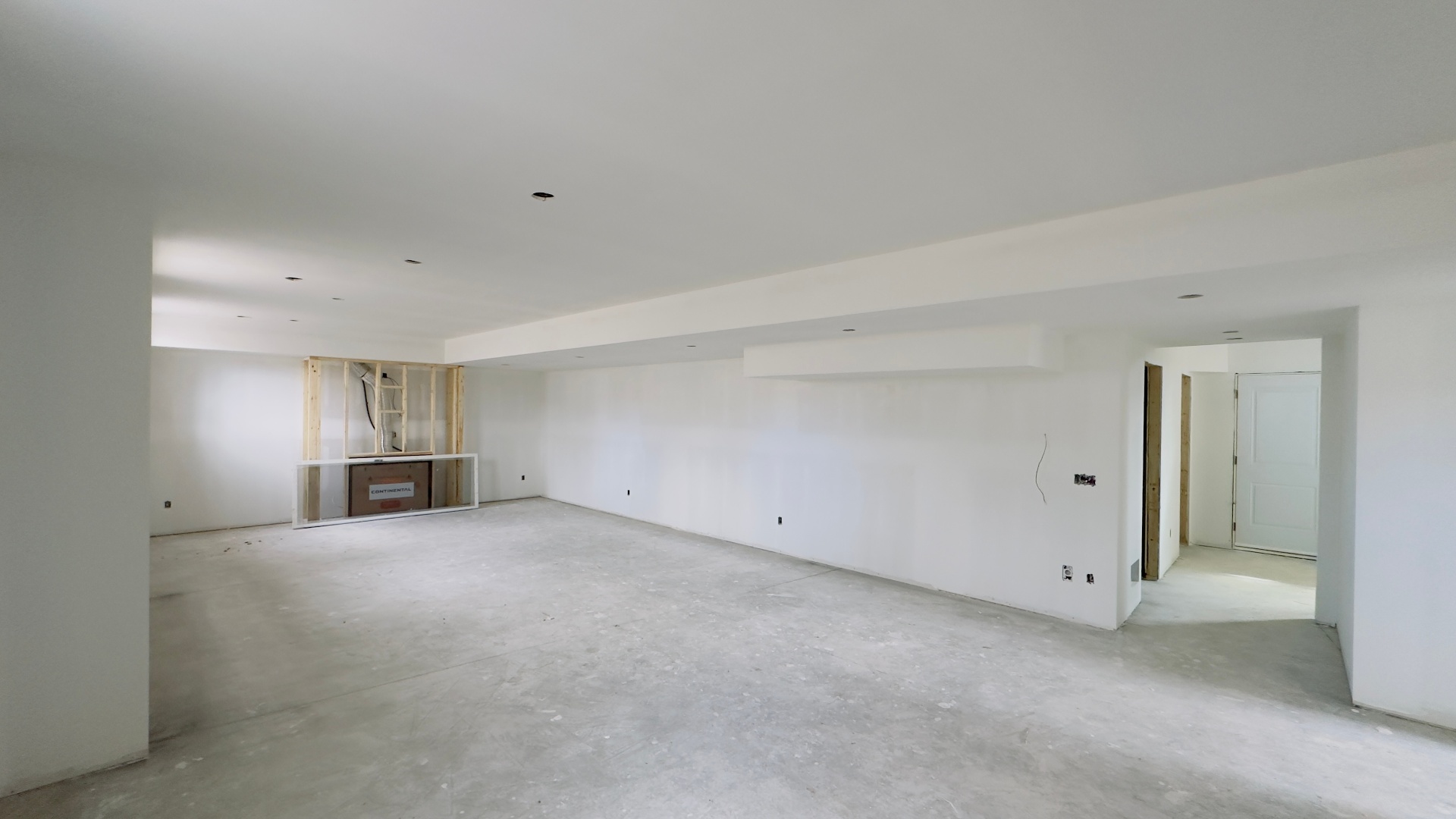 Basement renovation drywall stage with finished walls and ceiling in Niagara