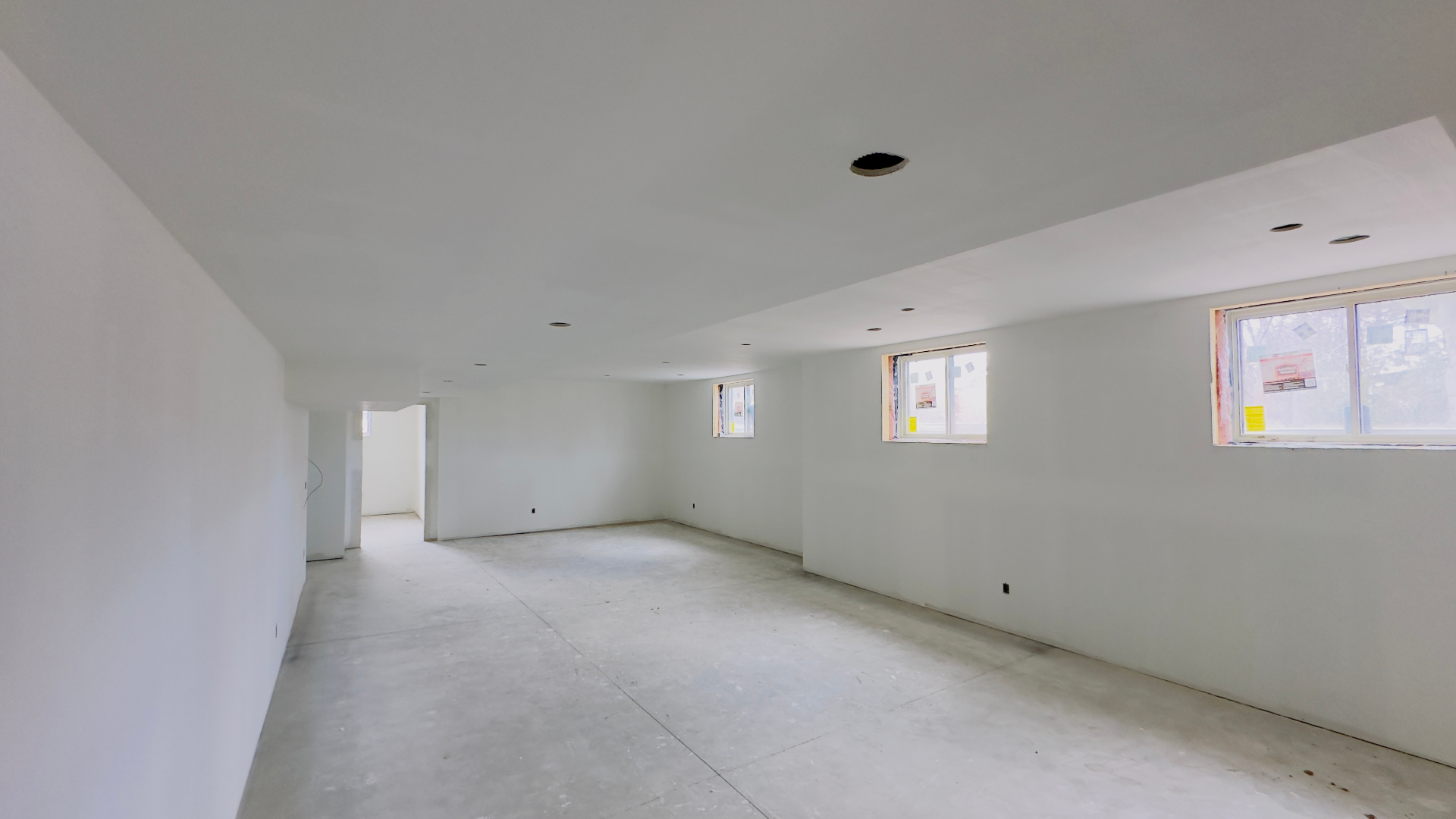 Basement renovation drywall and ceiling with new windows in Niagara