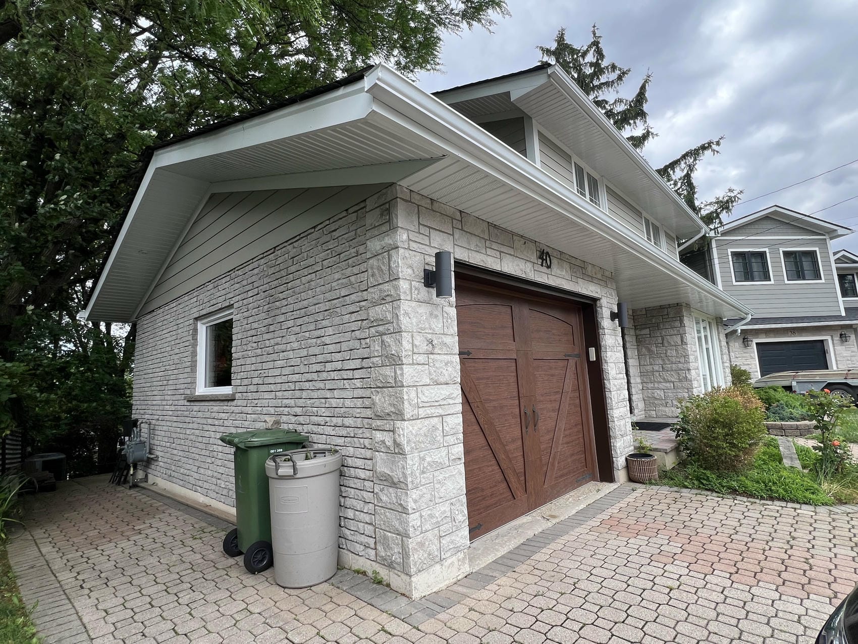 New soffit, fascia, and eavestroughs installed on Hamilton residential renovation