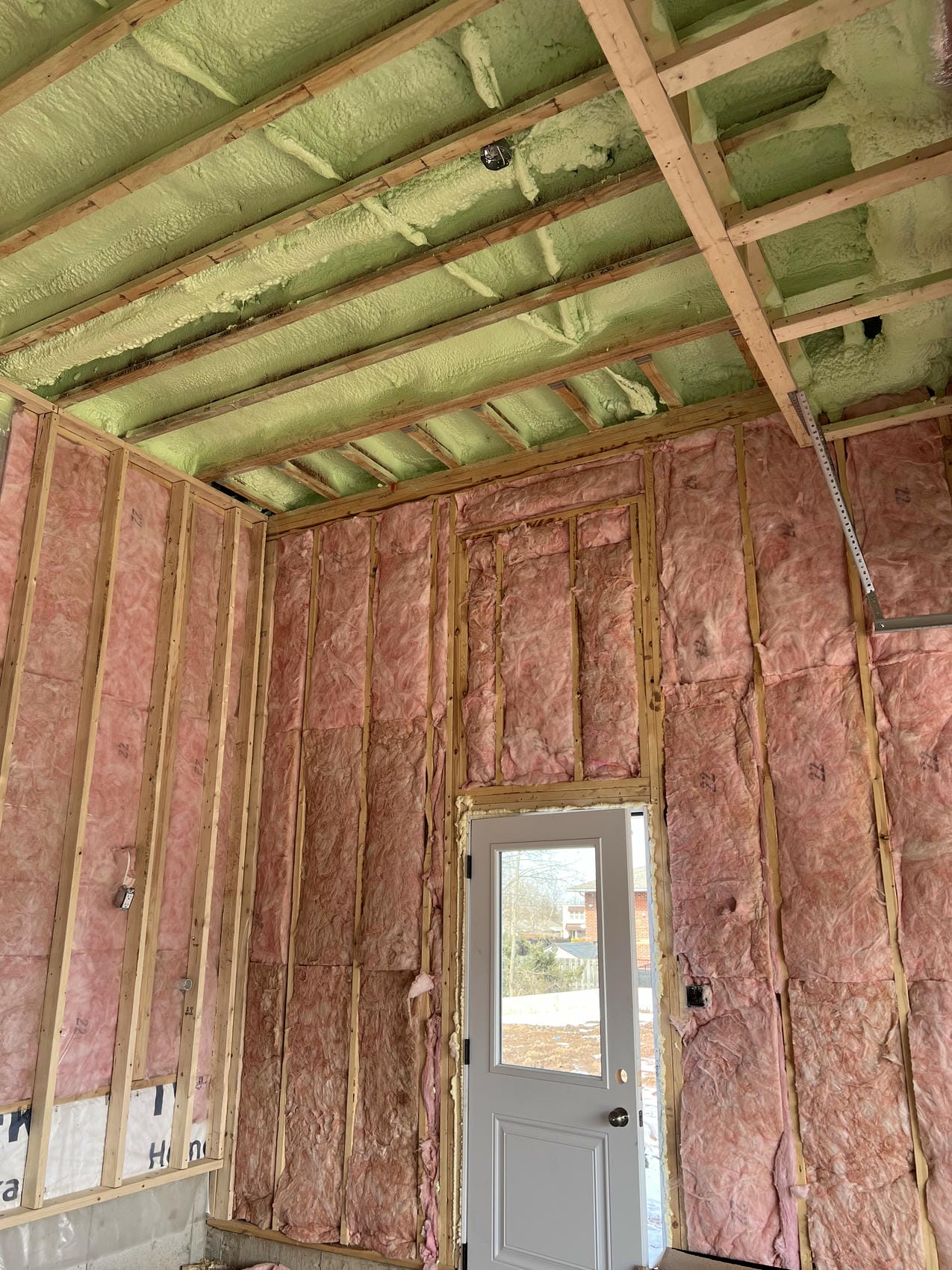 Spray foam ceiling insulation with fibreglass wall insulation in Niagara garage
