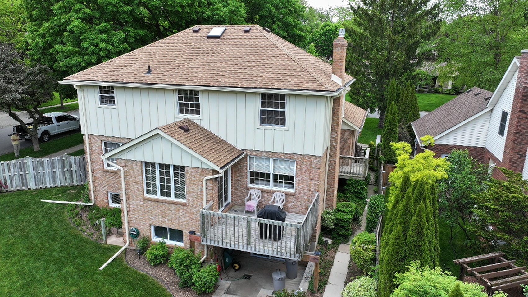 Rear elevation of completed board and batten siding renovation in Pelham
