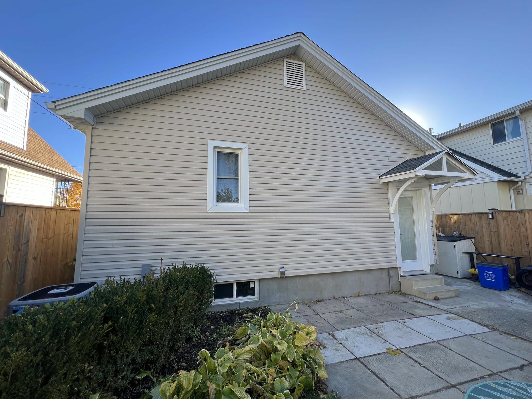 Side elevation of finished horizontal vinyl siding renovation in St. Catharines