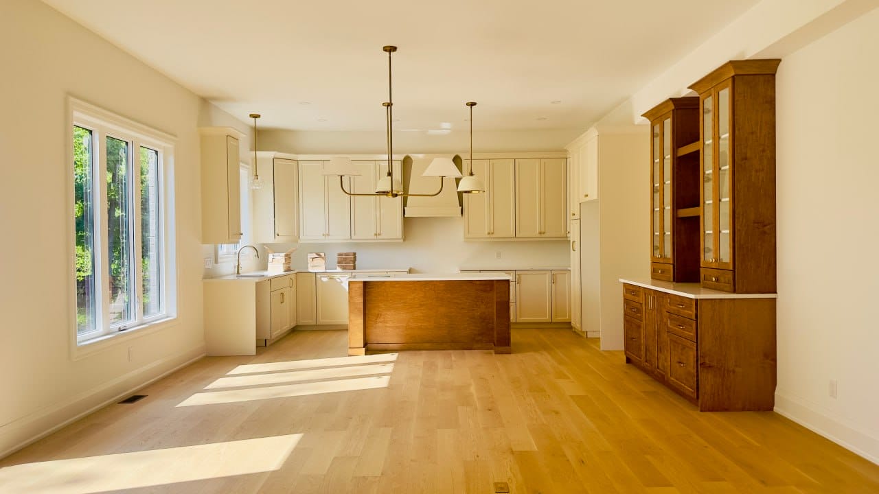 Grimsby interior renovation — custom kitchen cabinetry with wood island and built-in hutch