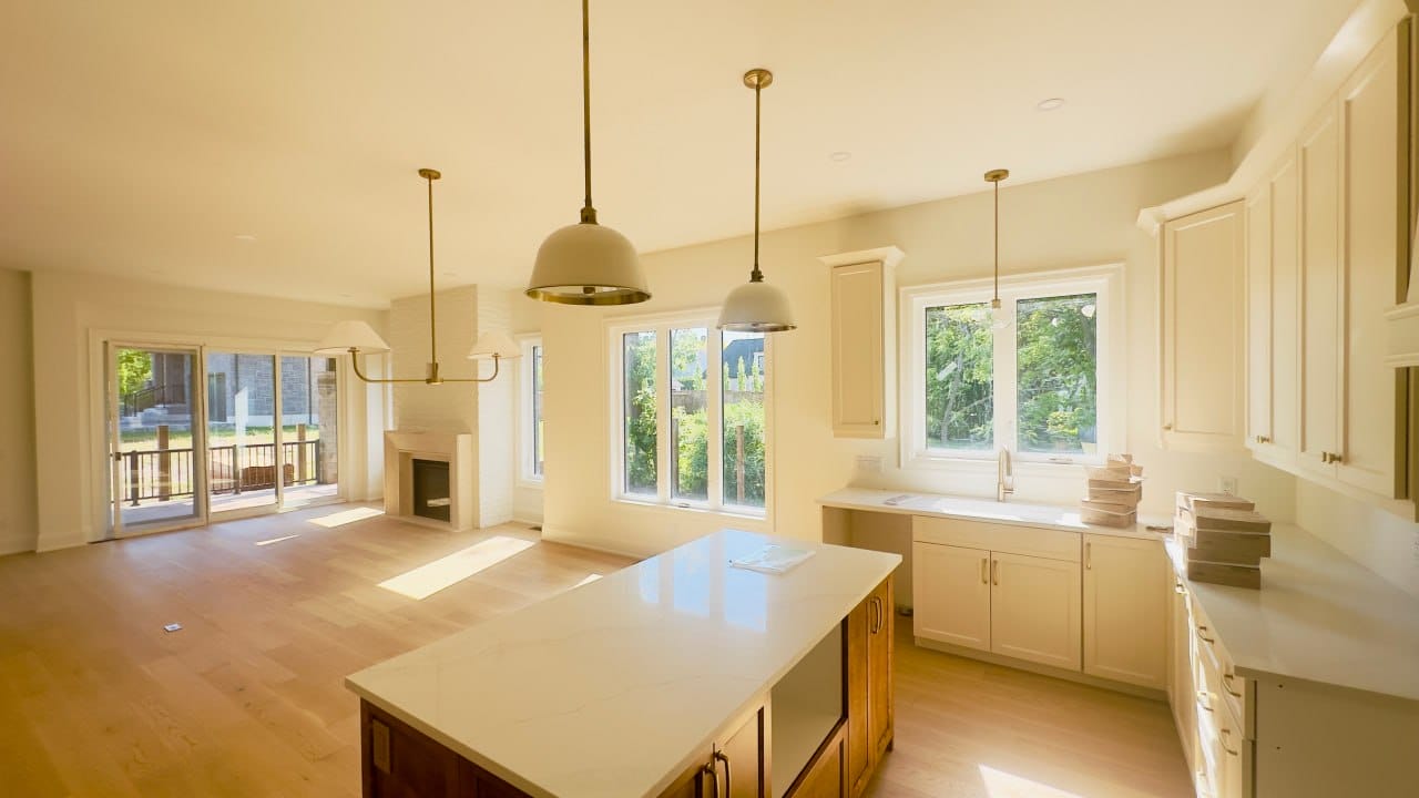 Grimsby interior renovation — bright open-concept kitchen with quartz island and pendant lighting