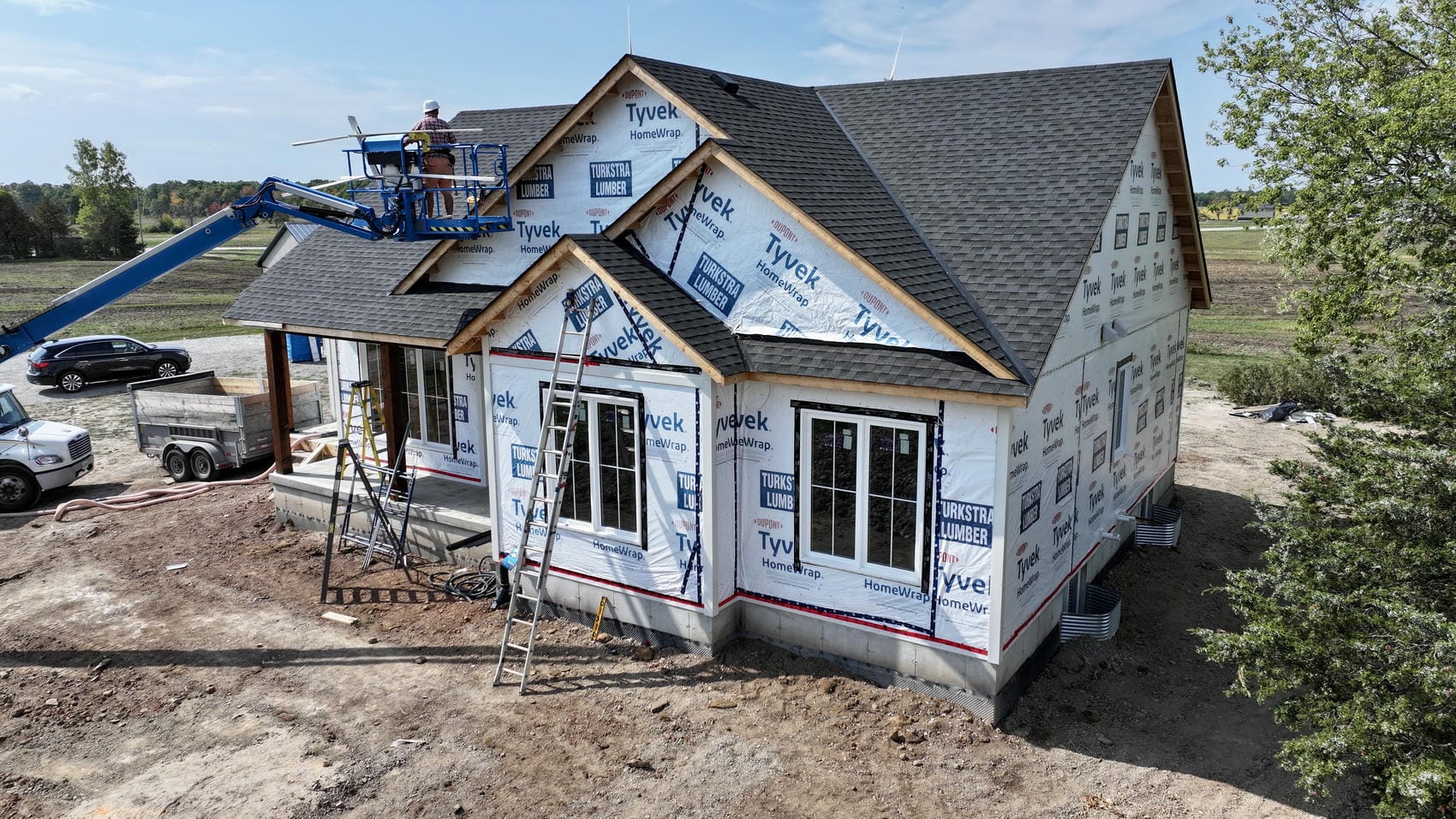 White board and batten new build exterior installation in progress in Grimsby, Ontario
